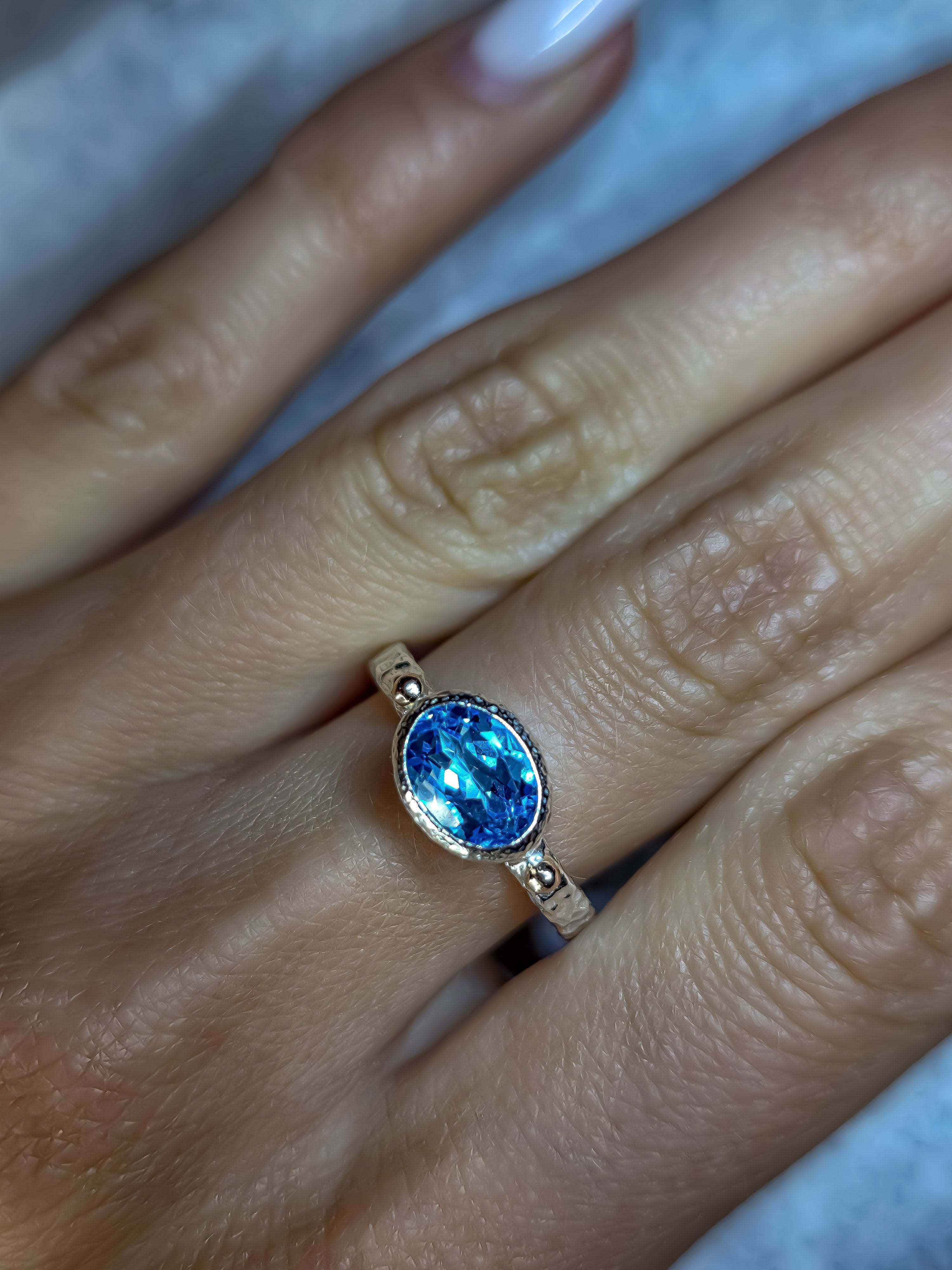 925 sterling silver ring with a natural Swiss Blue topaz and rose gold drops