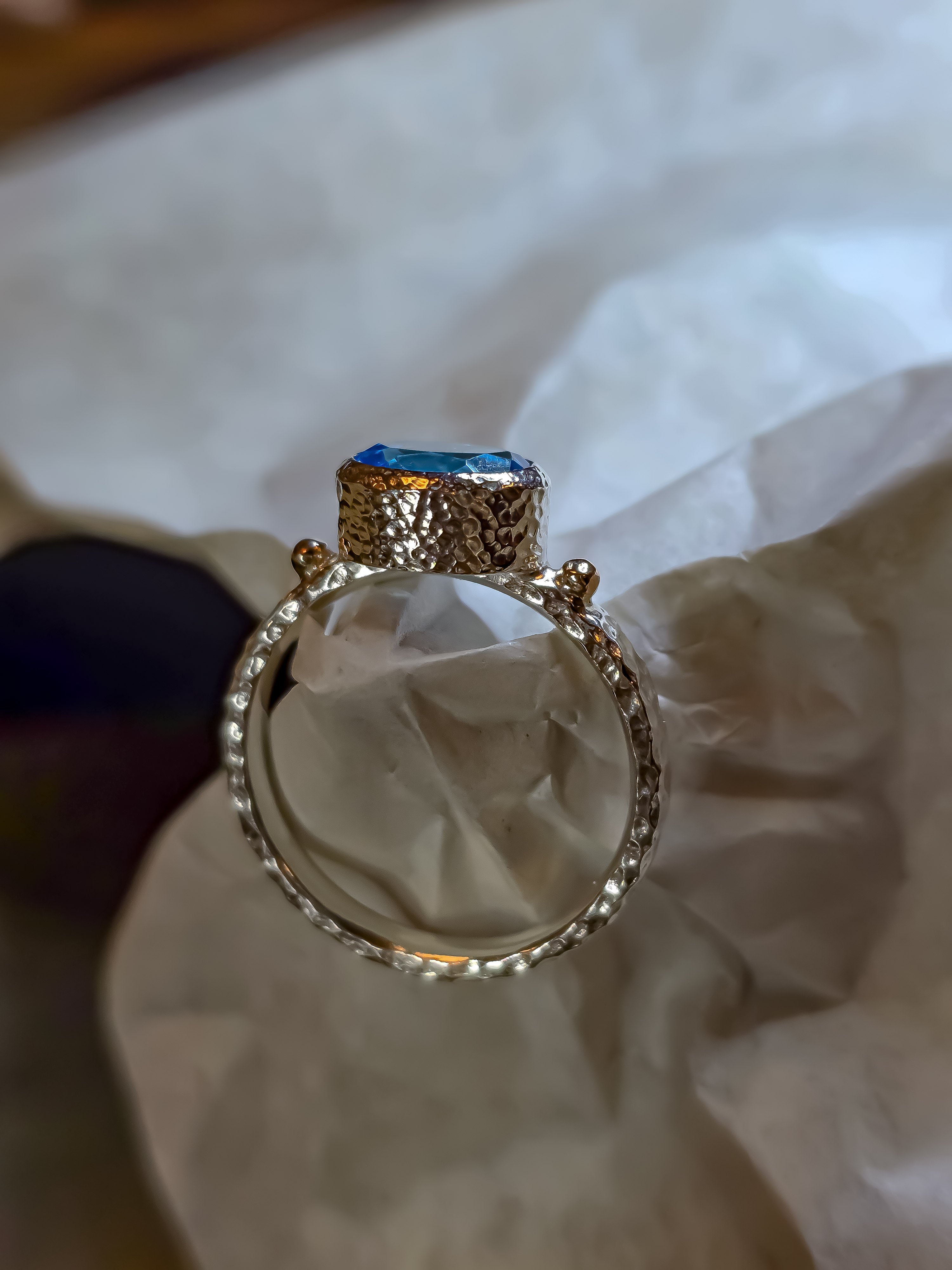 925 sterling silver ring with a natural Swiss Blue topaz and rose gold drops