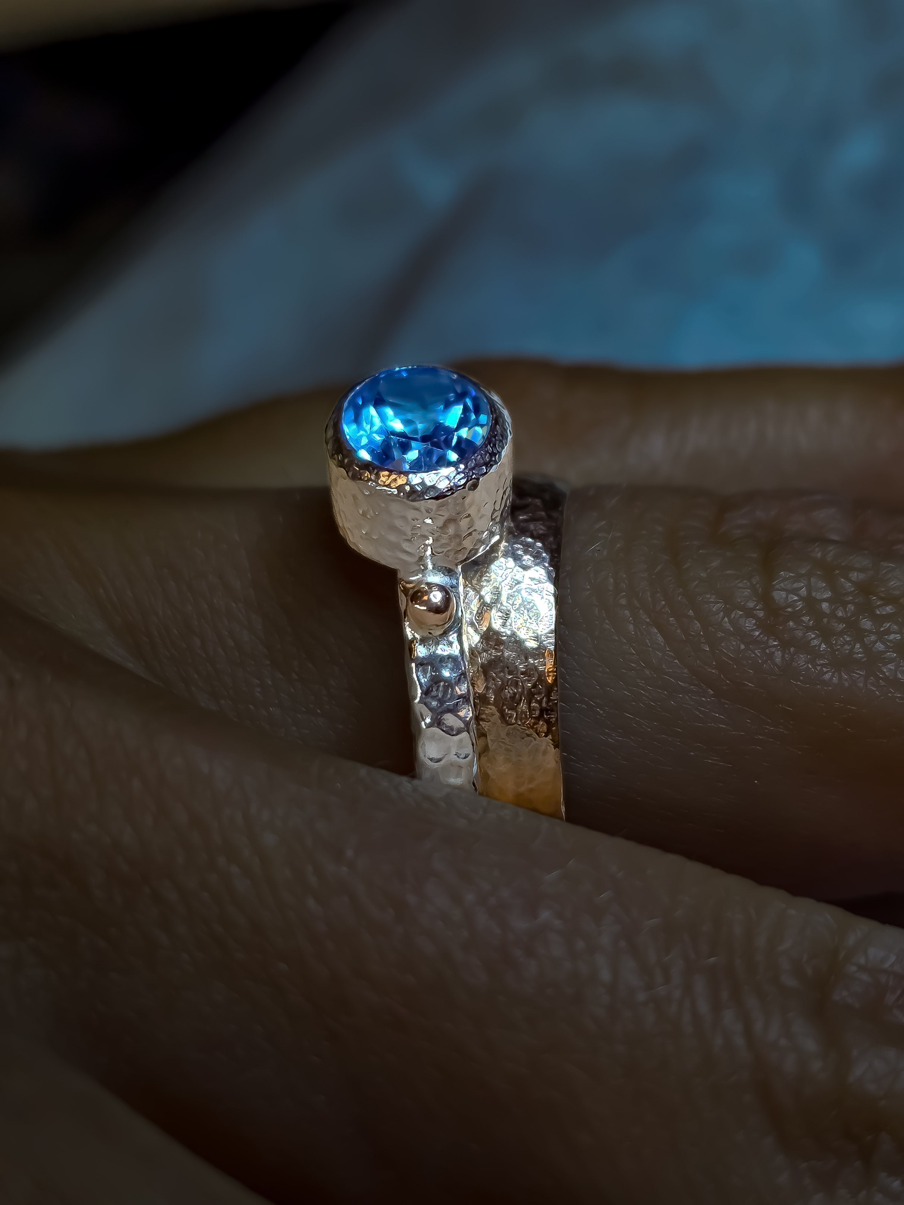 925 sterling silver ring with a natural Swiss Blue topaz and rose gold drops